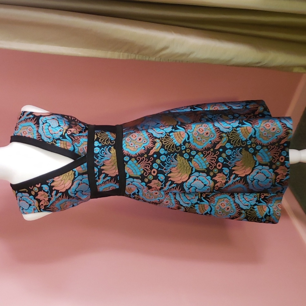 One Etro dress with shades of easter egg blue, apricot, and light brown.